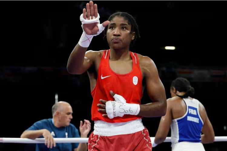 Boxer Cindy Ngamba creates history in the Olympics by winning a medal as the first refugee