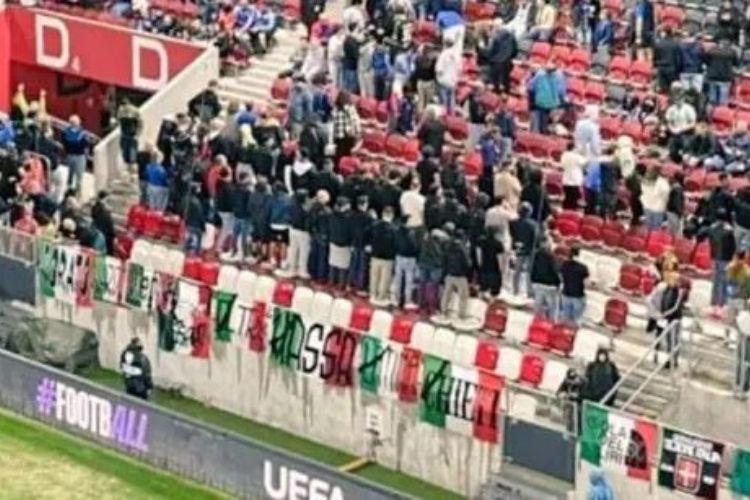 Italy fans show their backs during Israel's national anthem before the Nations League match