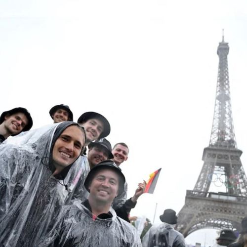 Rainy Paris Olympics parade hurts many spectators' spirits